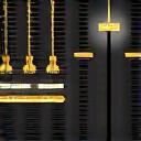 Icon of a mixing board slider and audio waveforms.